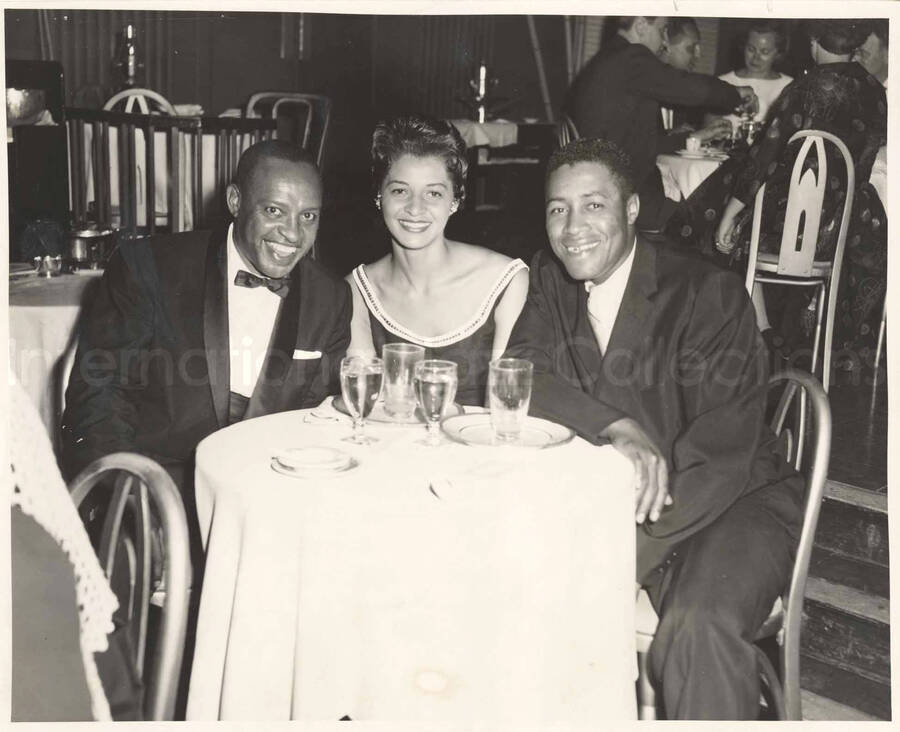 8 x 10 inch photograph. Lionel Hampton with baseball player Elston Howard and unidentified woman