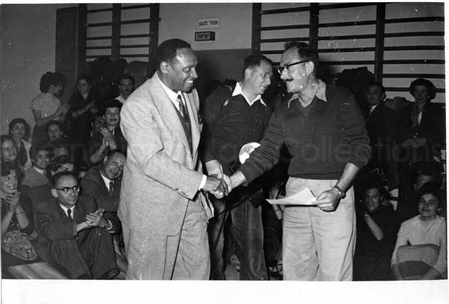 5 x 7 inch photograph. Gladys and Lionel Hampton with band in Israel