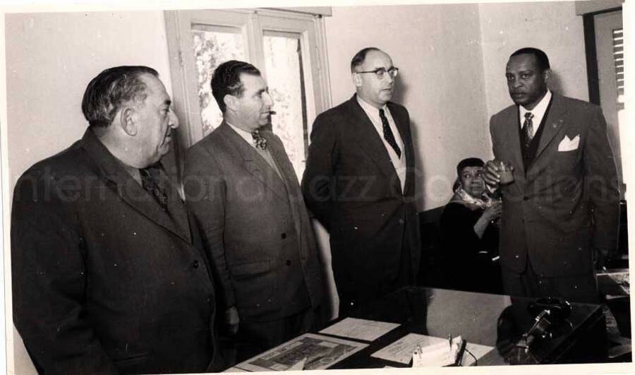 5 x 8 inch photograph. Gladys and Lionel Hampton with band in Israel. Lionel Hampton with unidentified men