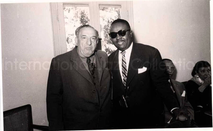 5 x 8 inch photograph. Gladys and Lionel Hampton with band in Israel. Unidentified men