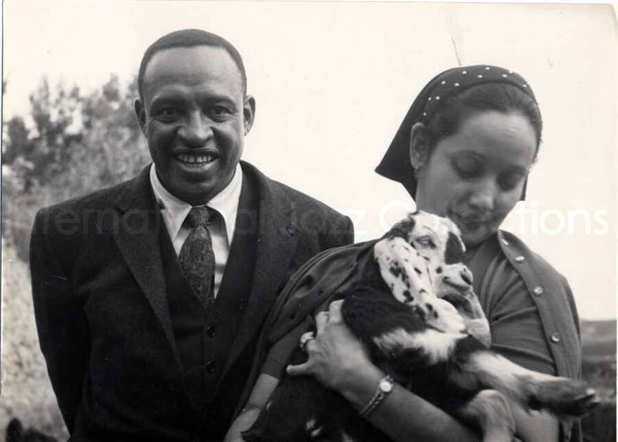 5 x 7 inch photograph. Lionel Hampton with unidentified woman in visit to an archaeological site in Israel. [From a photo album identified as The Outpost Kibbutz of Ramat Rachel?]