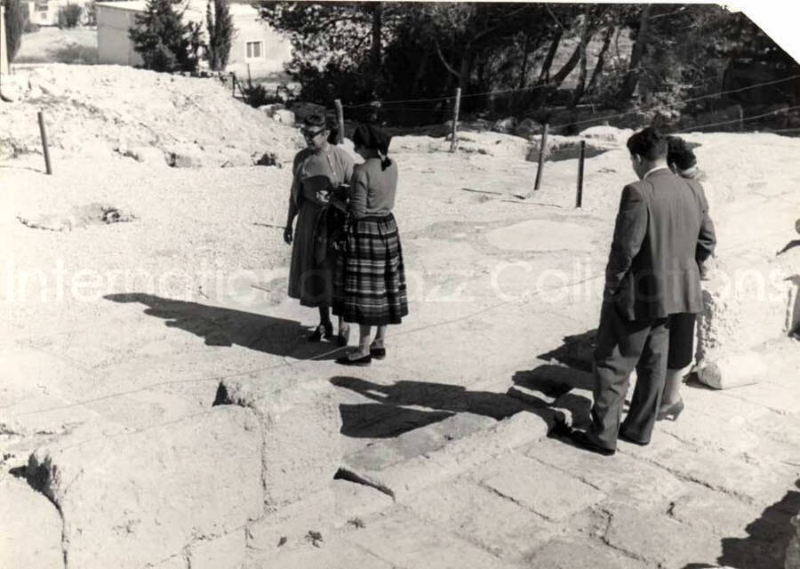 5 x 7 inch photograph. Gladys Hampton with unidentified persons in visit to an archaeological site in Israel. [From a photo album identified as The Outpost Kibbutz of Ramat Rachel?]. See also LH.III.2500