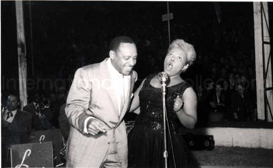 5 x 8 inch photograph. Lionel Hampton performing with band in Israel. Lionel Hampton with unidentified vocalist