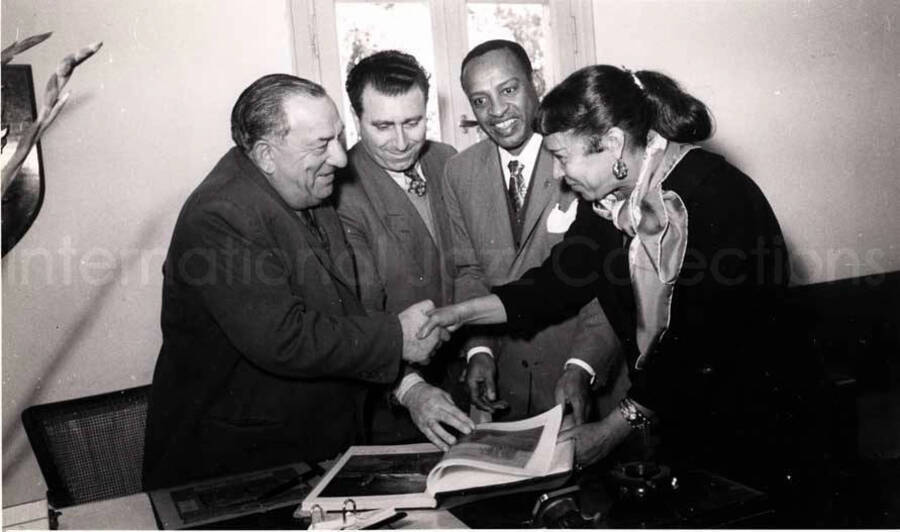 5 x 8 inch photograph. Gladys and Lionel Hampton with band in Israel. Gladys and Lionel Hampton with two unidentified men