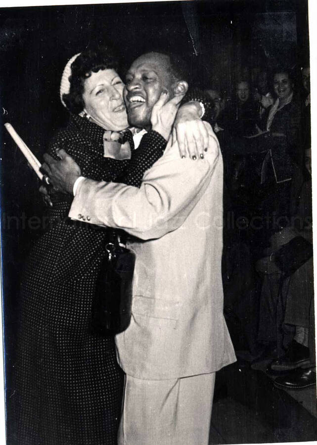 6 x 4 1/2 inch photograph. Lionel Hampton performing with band in Israel. Lionel Hampton with unidentified woman