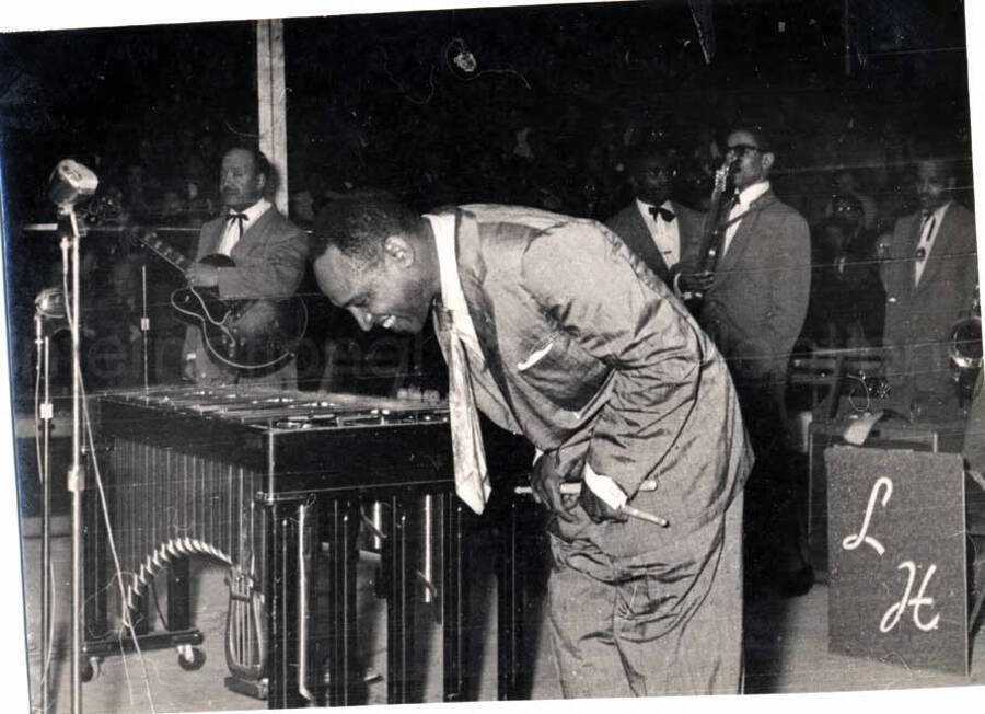 4 1/2 x 6 inch photograph. Lionel Hampton performing with band, which includes guitarist Billy Mackel, in Israel