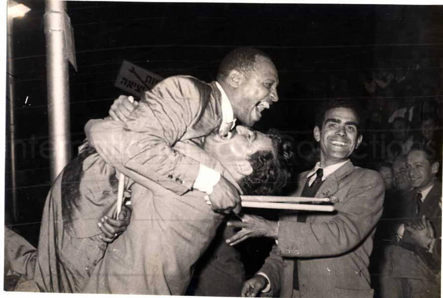 4 1/2 x 6 inch photograph. Lionel Hampton performing with band in Israel. Lionel Hampton with unidentified men