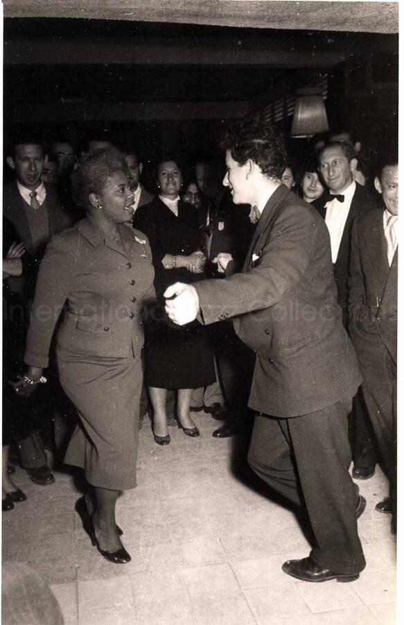 5 x 8 inch photograph. Vocalist of Lionel Hampton's band dancing with unidentified man in a restaurant in Israel