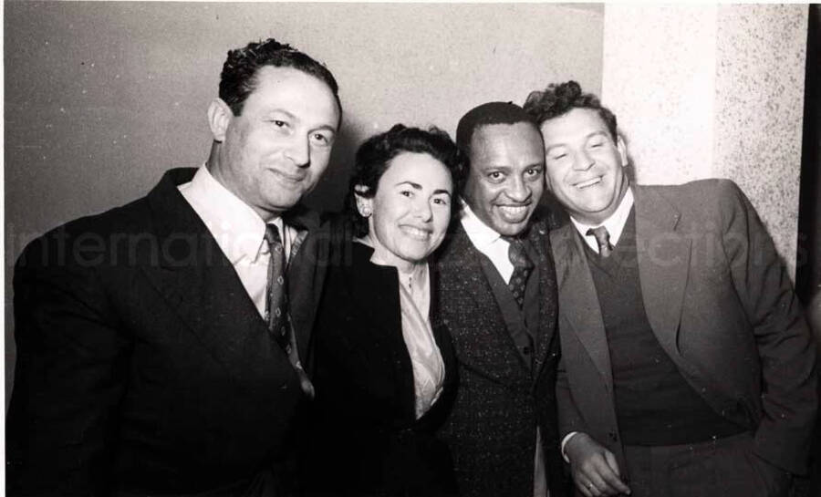 5 x 8 inch photograph. Lionel Hampton with unidentified persons in a restaurant in Israel