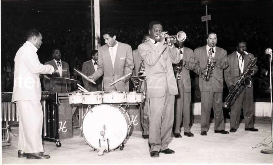 5 x 8 inch photograph. Lionel Hampton performing with band in Israel. Lionel Hampton and Curley Hamner on drums