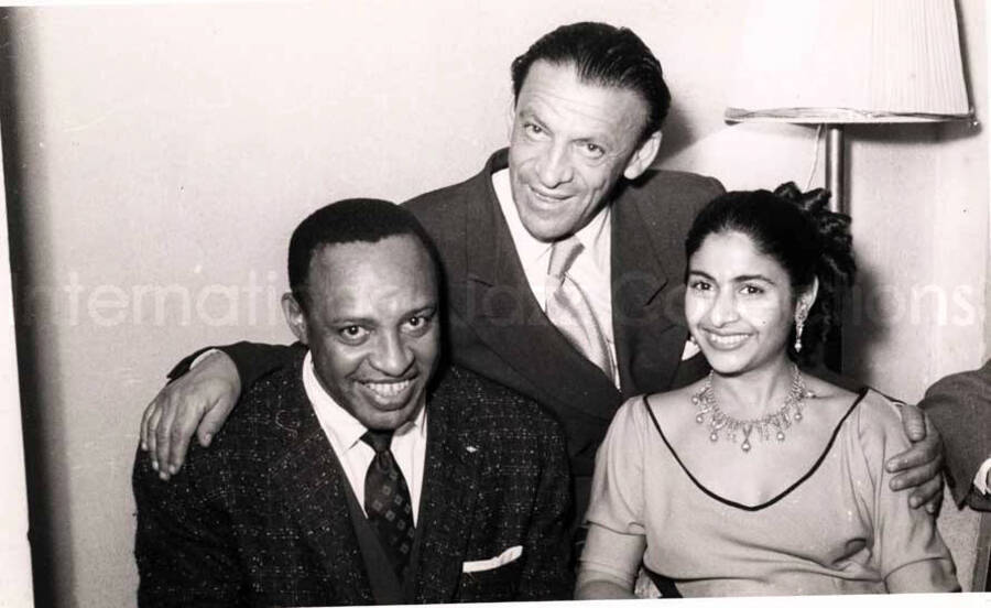 5 x 8 inch photograph. Lionel Hampton with unidentified persons in a restaurant in Israel