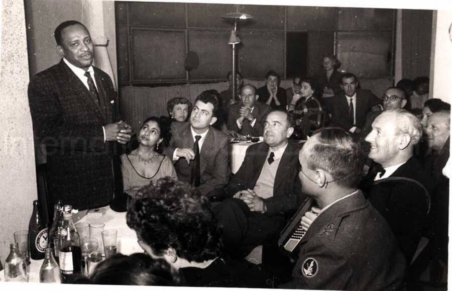 5 x 8 inch photograph. Lionel Hampton with unidentified persons in a restaurant in Israel