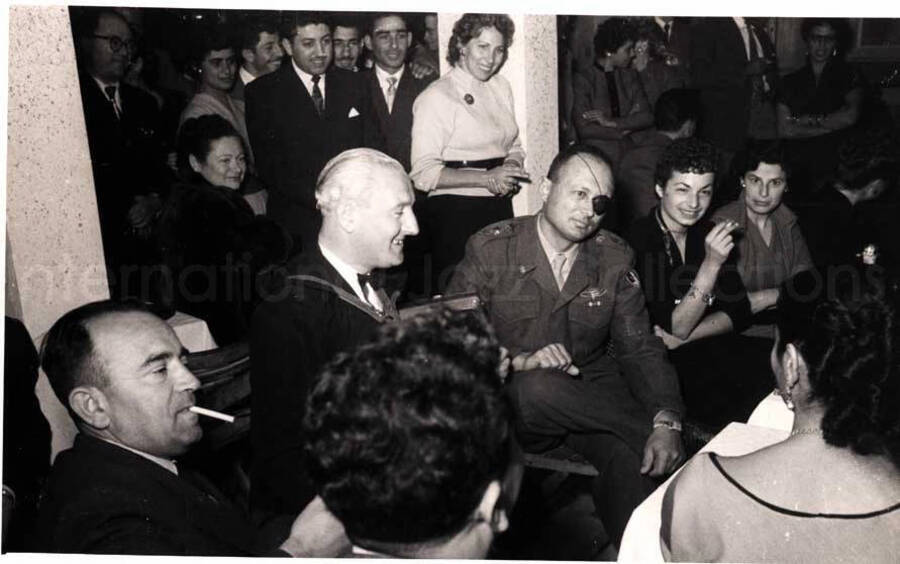 5 x 8 inch photograph. Unidentified persons in a restaurant in Israel
