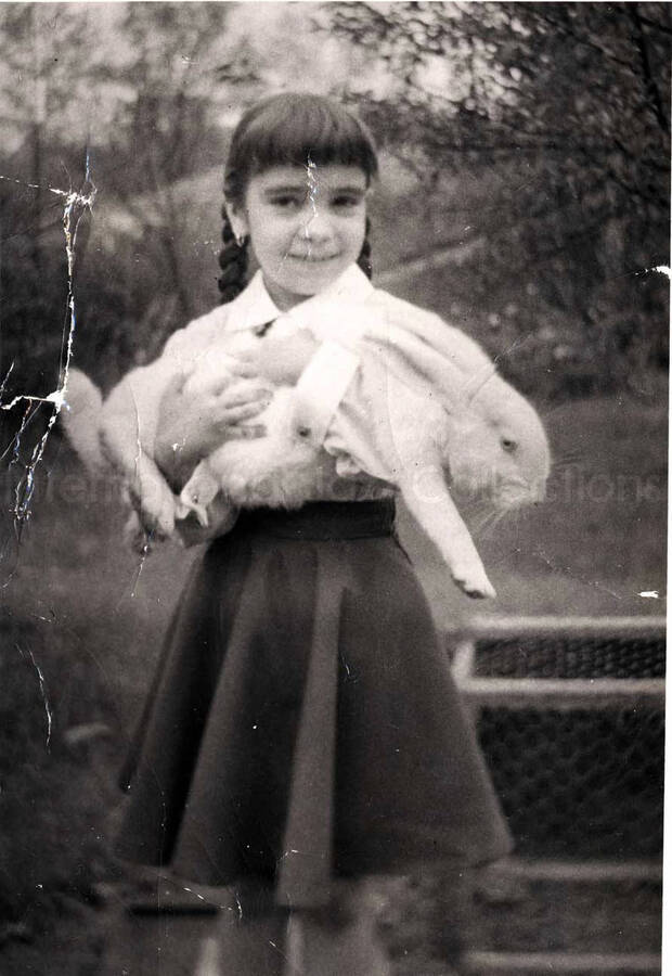 7 x 5 inch photograph. Girl with rabbit