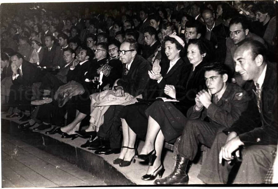 5 x 7 inch photograph. Audience in Israel. Handwritten on the back of the photograph: Crowd at the [Firatron?] Centre