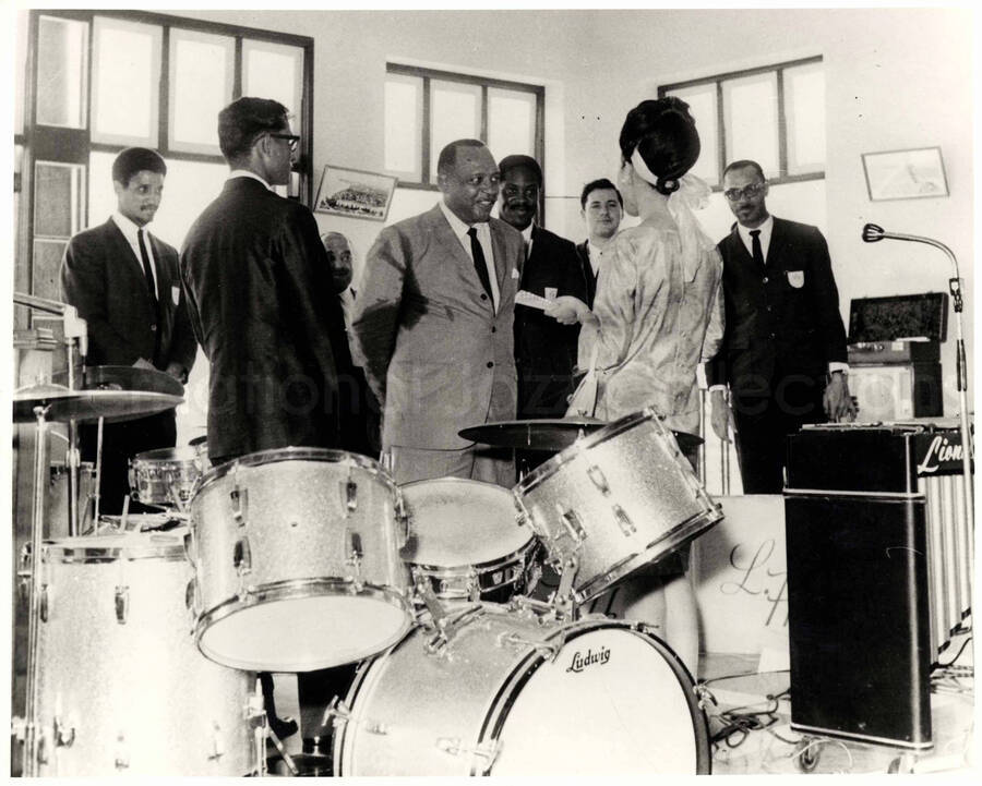 8 x 10 inch photograph. Lionel Hampton with band, which includes guitarist Billy Mackel, in Thailand