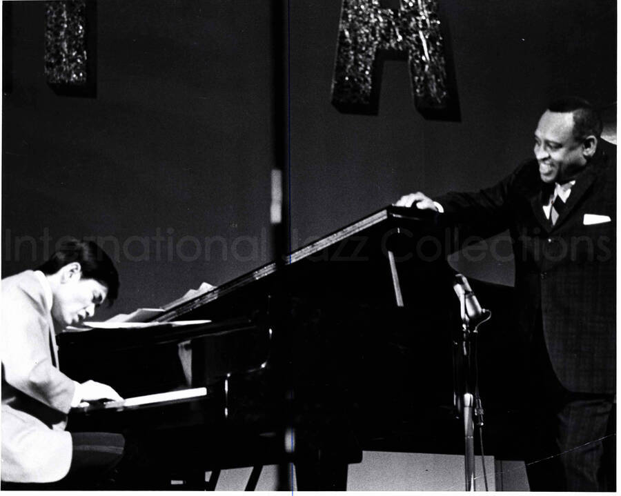 8 x 10 inch photograph. Lionel Hampton with unidentified pianist [in Japan?]