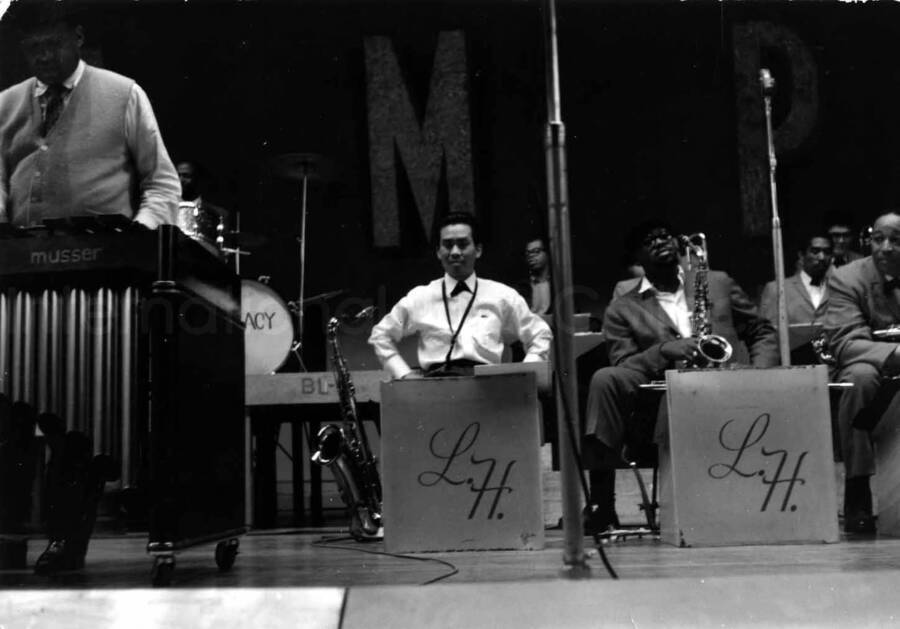 3 1/5 x 5 inch photograph. Lionel Hampton playing the vibraphone with orchestra [in Japan?]