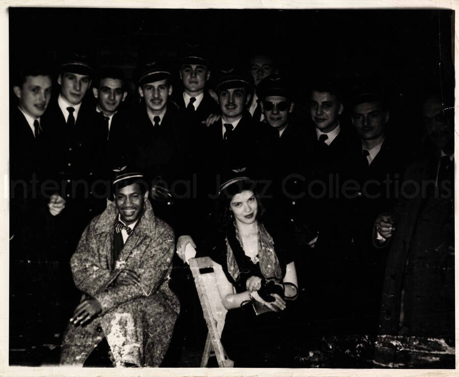 8 x 10 inch photograph. [Curley Hamner?] with U.S. Air Force personnel