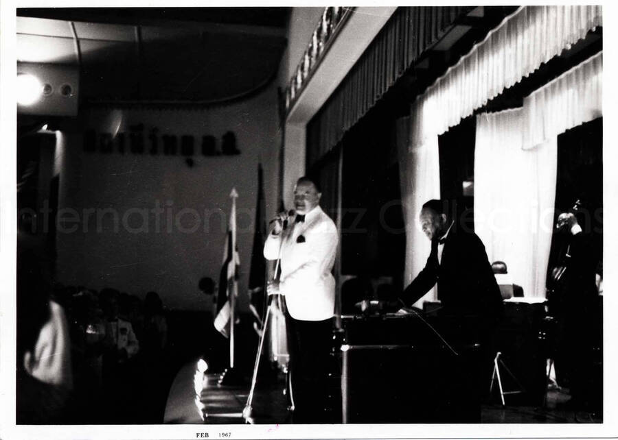 4 3/4 x 6 1/2 inch photograph. Lionel Hampton on stage with Bob Hope