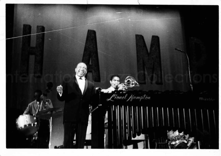 3 1/2 x 5 inch photograph. Lionel Hampton with orchestra [in Japan?]