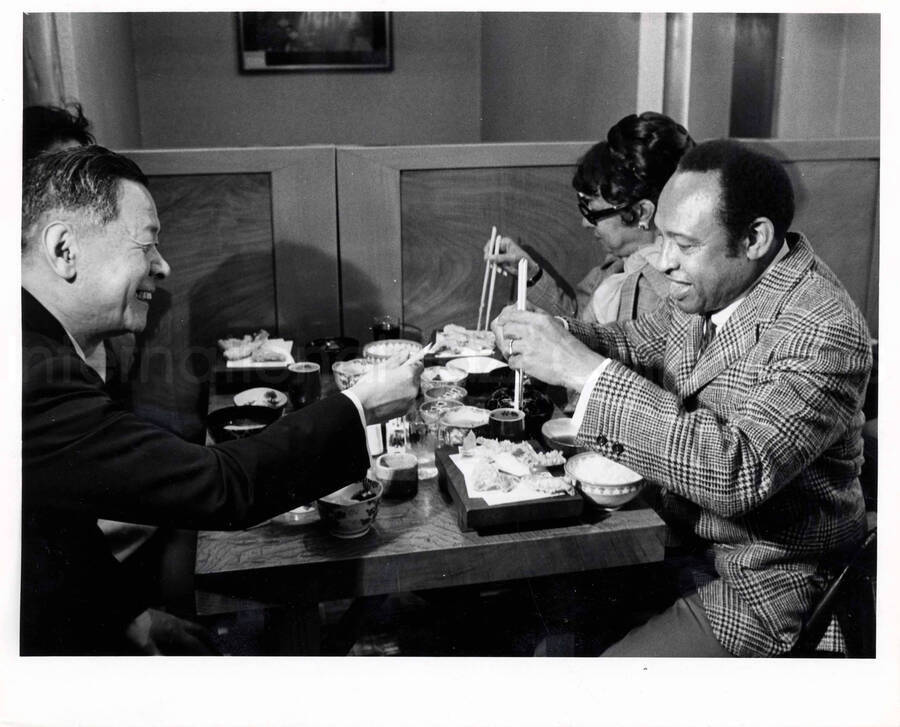 8 x 10 inch photograph. Gladys and Lionel Hampton in downtown Tokyo, Japan