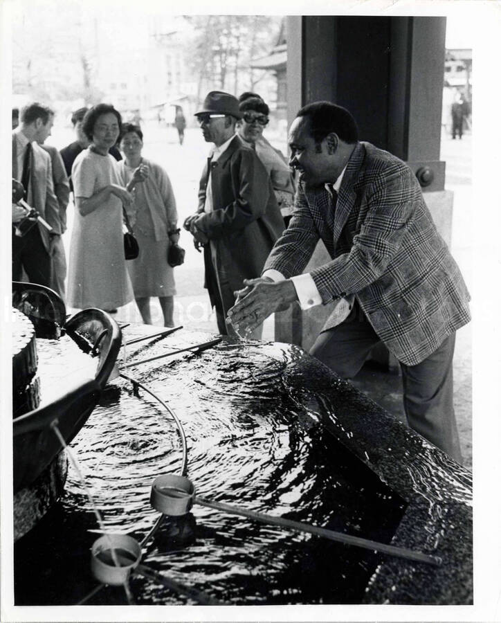 10 x 8 inch photograph. Gladys and Lionel Hampton in downtown Tokyo, Japan