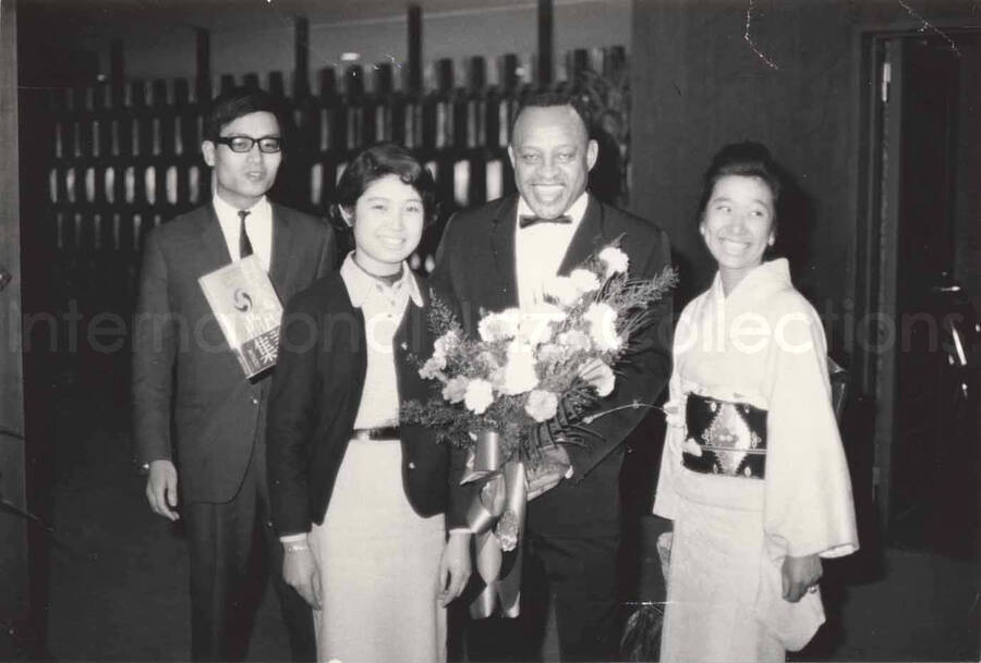3 x 4 1/2 inch photograph. Lionel Hampton with unidentified persons, in Osaka, Japan