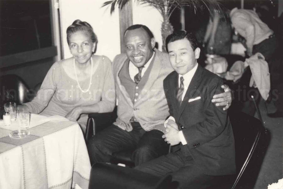 3 x 4 1/2 inch photograph. Lionel Hampton with unidentified man and woman in Osaka, Japan