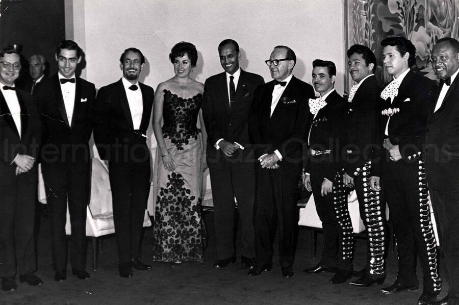 6 1/2 x 9 1/2 inch photograph. Lionel Hampton with unidentified persons