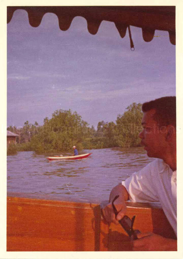 3 1/2 x 2 1/2 inch photograph. Leo Moore on a boat