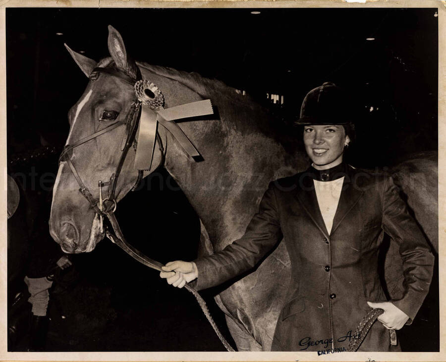 8 x 10 inch photograph. Judy Severinsen posing with her horse showing a prize