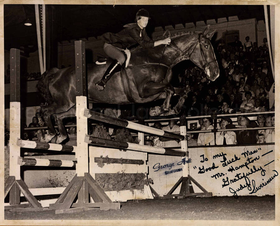 8 x 10 inch photograph. Judy Severinsen jumping over an obstacle with her horse. This photograph is dedicated to Lionel Hampton