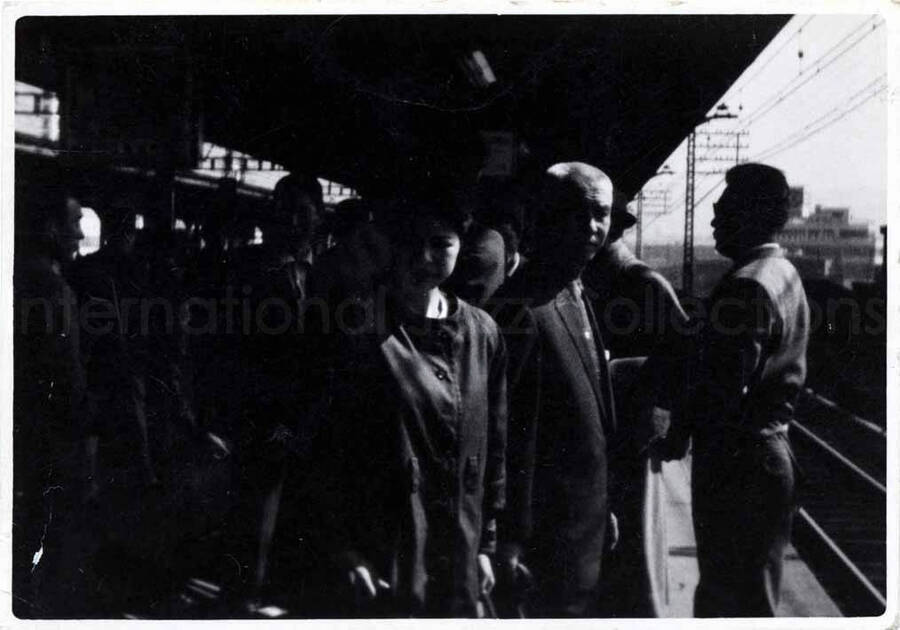 2 1/2 x 3 1/2 inch photograph. Members of the Lionel Hampton's band on a train station [in Japan]