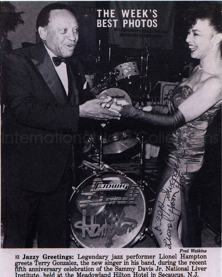 10 x8 inch photograph. This is a copy of a signed clipping from Jet Magazineentitled: The week's best photos. It depicts a photograph by Fred Watkins of Lionel Hampton greeting Terry Gonzalez, a recently-hired singer in his band, in the fifth anniversary of the Sammy Davis Jr. National Liver Institute, at the Meadowland Hilton Hotel in Secaucus, NJ