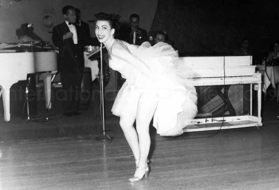 5 x 7 inch photograph. Unidentified woman dancing on stage at the Club Indigo