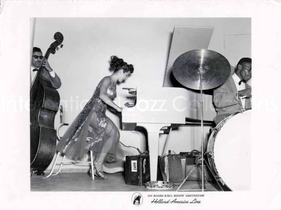 4 1/4 x 5 3/4 inch photograph. Unidentified musicians. Inscribed at the bottom of the photograph: on board R.M.S. Nieuw Amsterdam; Holland-America Line