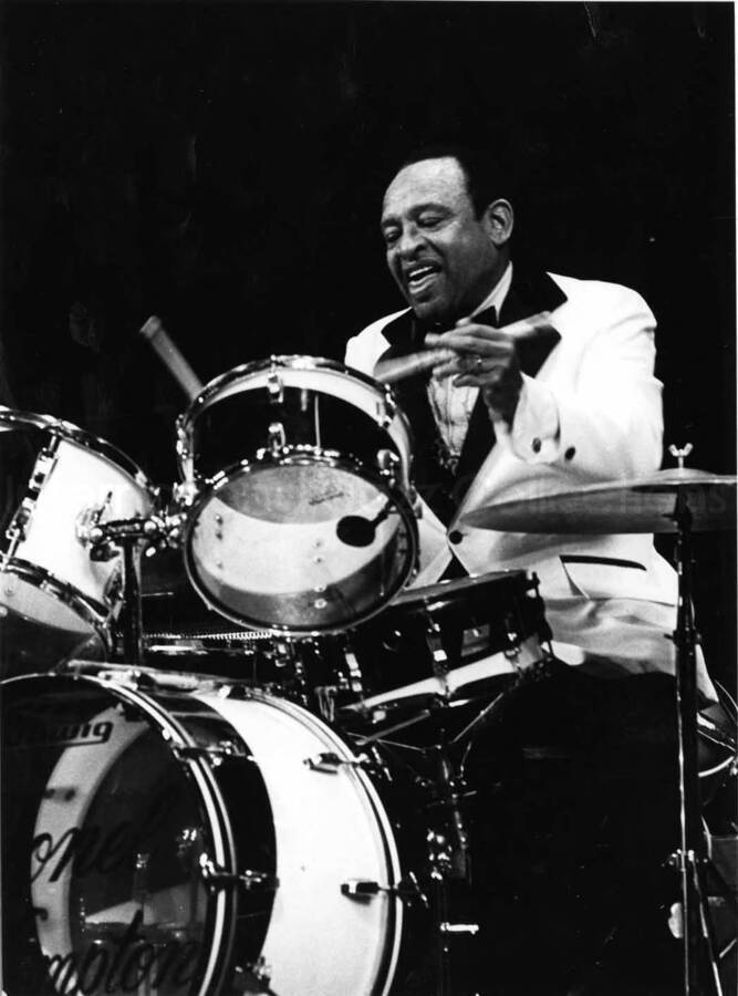 9 1/2 x 7 inch photograph. Lionel Hampton playing the drums. This photograph has a dedication from Willy