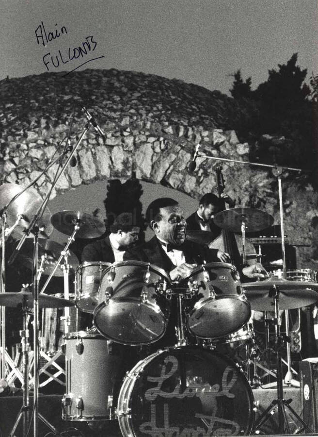 9 1/2 x 7 inch photograph. Lionel Hampton playing the drums. Handwritten on the photograph: Alain Fulconis