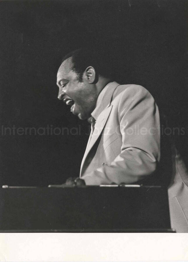 9 1/2 x 7 inch photograph. Lionel Hampton playing the vibraphone [in Geneva, Switzerland?]. This photograph has a dedication to Lionel Hampton on the back