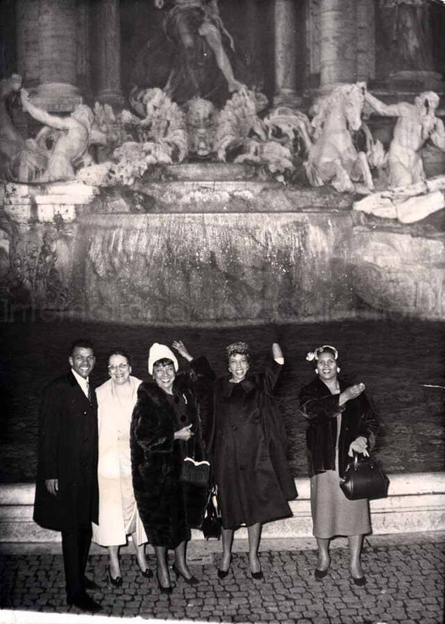 7 x 5 inch photograph. Gladys Hampton, Leo Moore, and unidentified persons at the Trevi Fountain in Rome, Italy