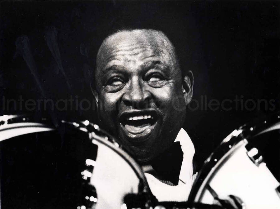 7 x 9 1/2 inch photograph. Lionel Hampton playing the drums [in France]