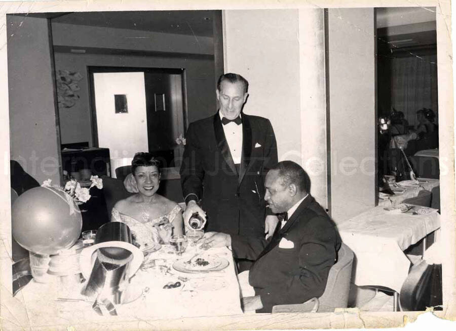 5 x 7 inch photograph. Gladys and Lionel Hampton in a restaurant