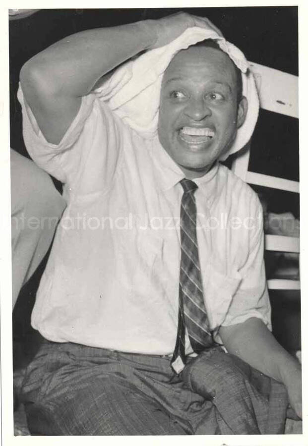 6 x 4 1/2 inch photograph. Lionel Hampton drying his head with a towel