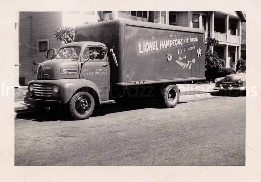 3 1/4 x 4 1/2 inch photograph. Lionel Hampton and His Orchestra's truck; Flyin' Home