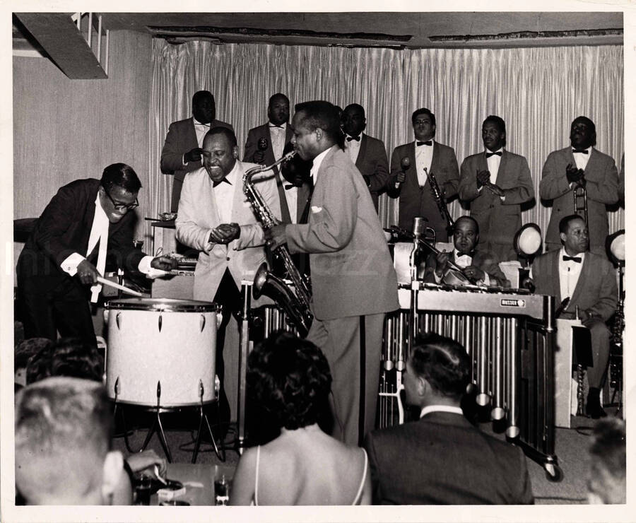 8 x 10 inch photograph. Sammy Davis, Jr. playing the drums with Lionel Hampton and orchestra
