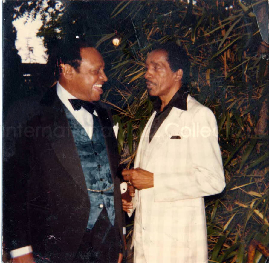 3 1/2 x 3 1/2 inch photograph. Lionel Hampton with unidentified man