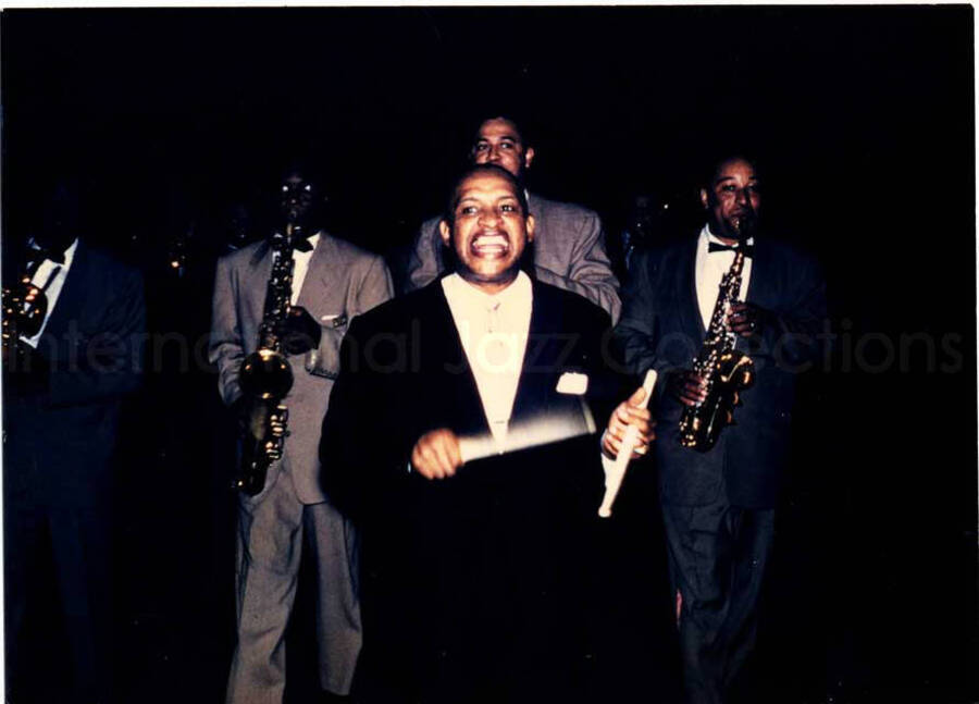 3 x 4 inch photograph. Lionel Hampton performing with saxophone section