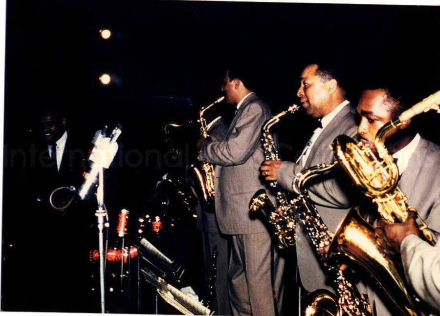 3 x 4 inch photograph. Lionel Hampton performing with saxophone section