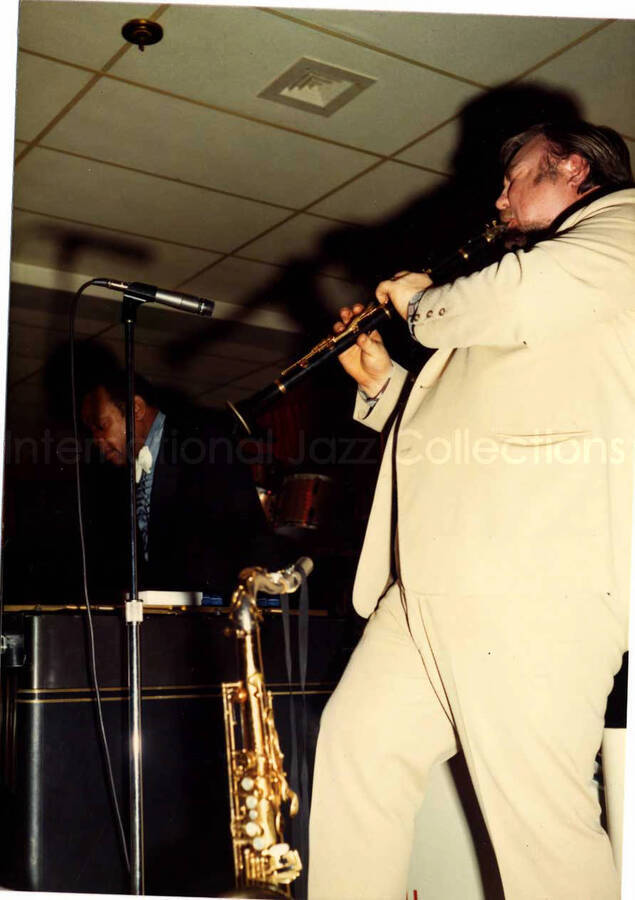 5 x 3 1/2 inch photograph. Lionel Hampton on vibraphone with unidentified clarinetist